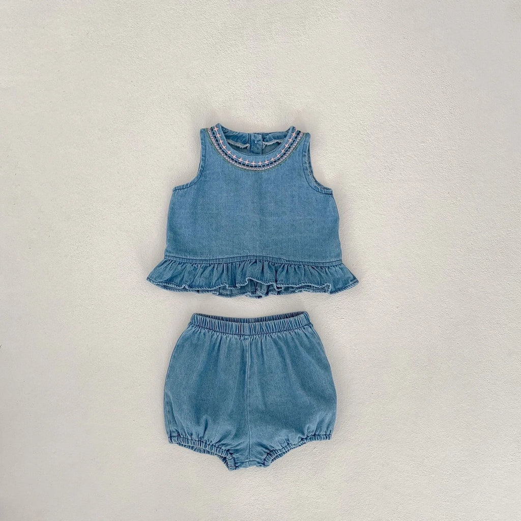 Baby girl denim cotton sleeveless two-piece suit with shorts on a white background