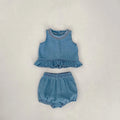 Baby girl denim cotton sleeveless two-piece suit with shorts on a white background
