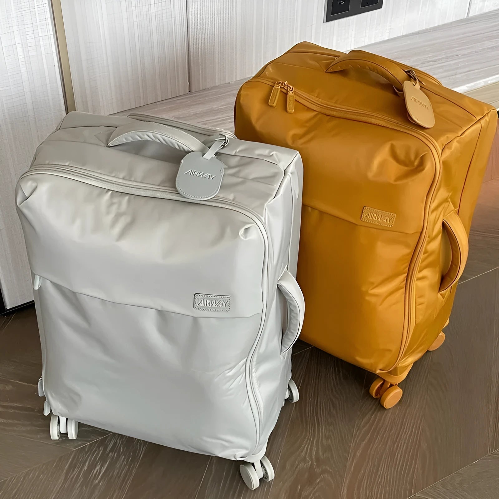 Tea brown coloured ultra-light waterproof Oxford cloth wheeled luggage suitcase in a 20-inch size.
