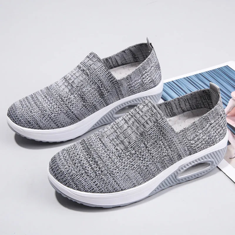 Women's black mesh running shoes with round toe and mid heel on a white background