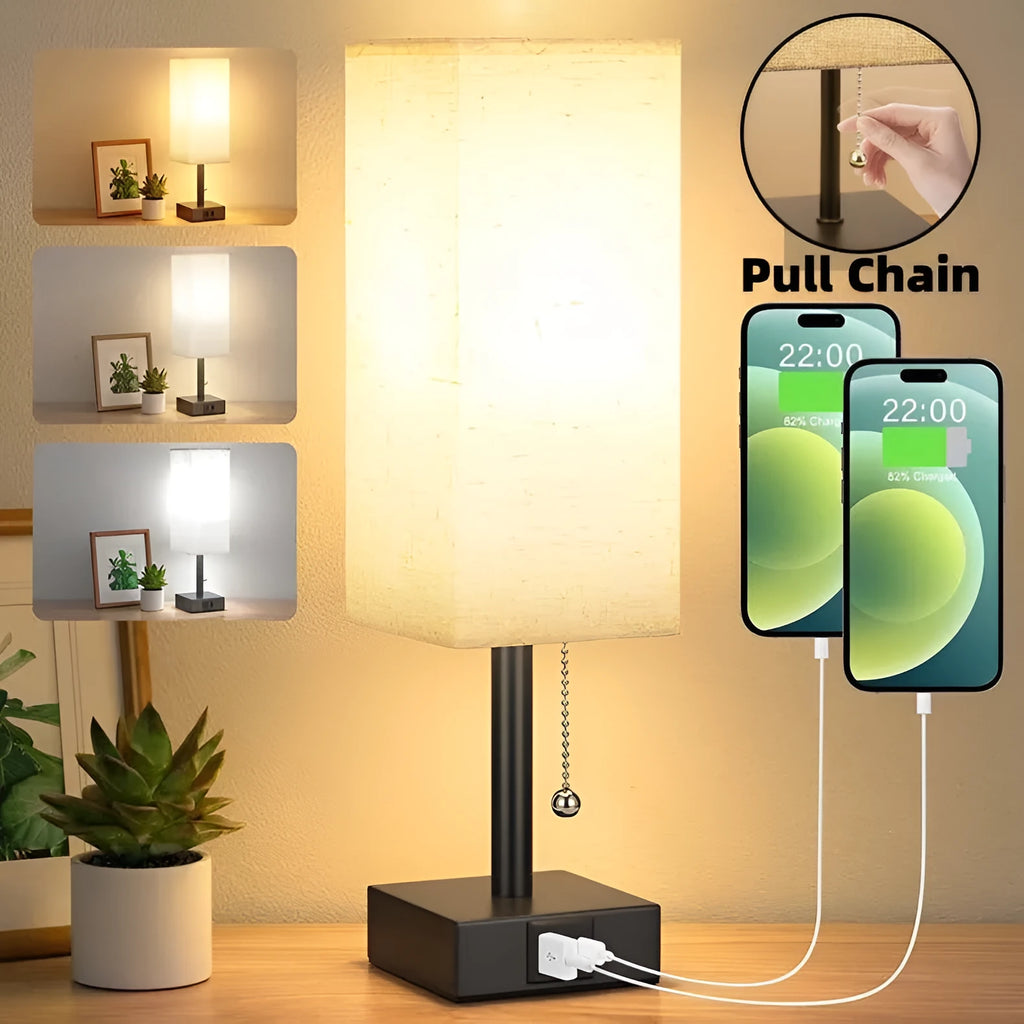 Small bedside table lamp with fabric shade and USB charging ports on a nightstand with pull chain control