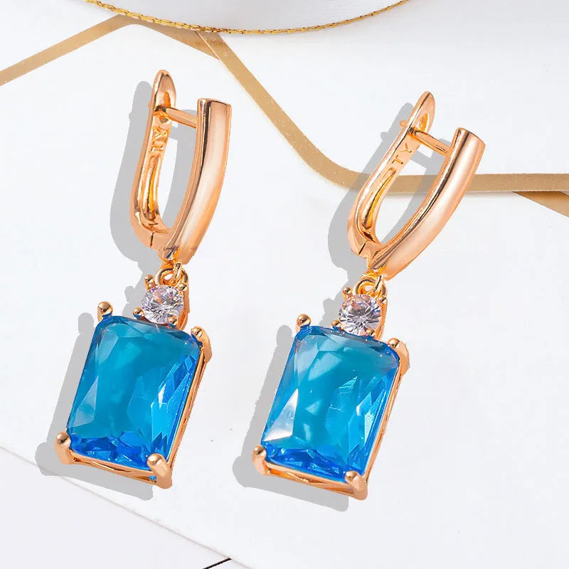 Square geometric copper earrings with electroplated gold or silver finish and quadrilateral design