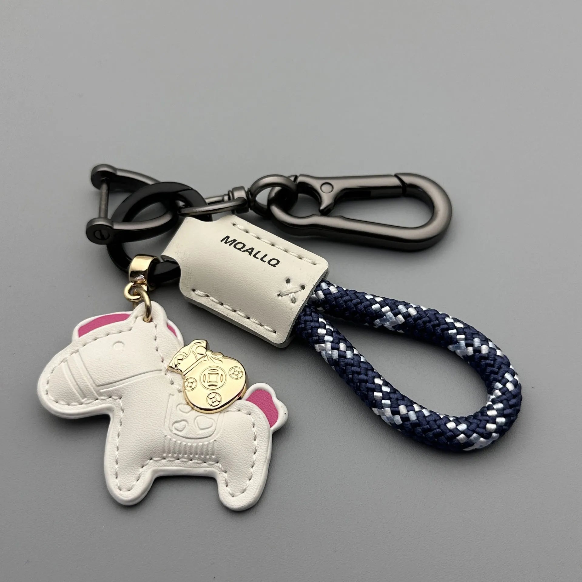Handmade brown cowhide leather keychain with a silver pony belt buckle charm and green velvet rope.