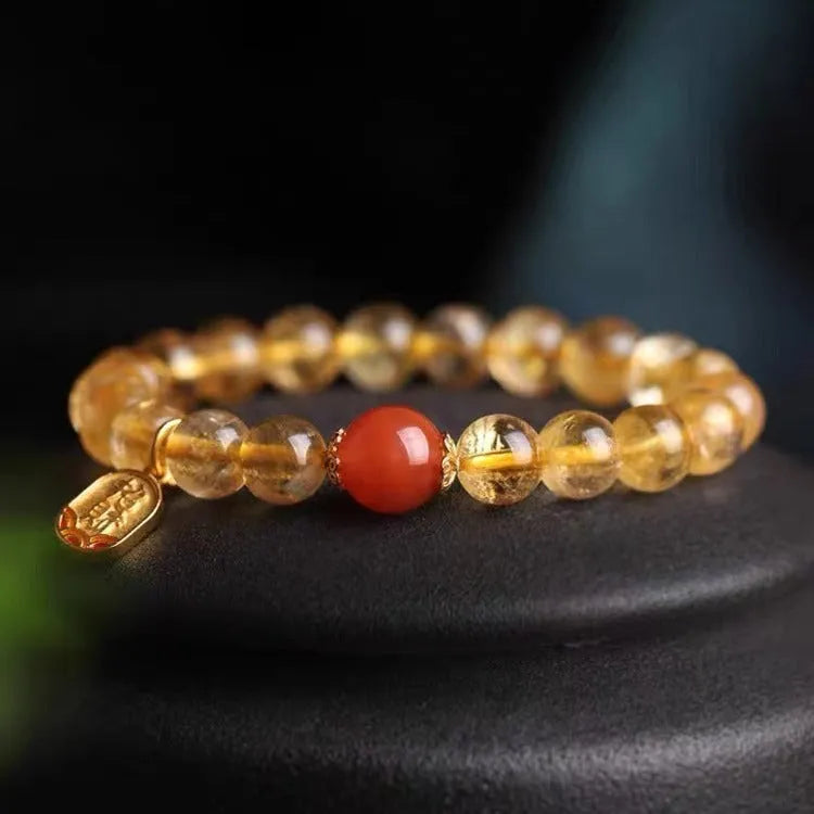 Polished natural red agate beaded bracelet showing stone texture and bead proportion