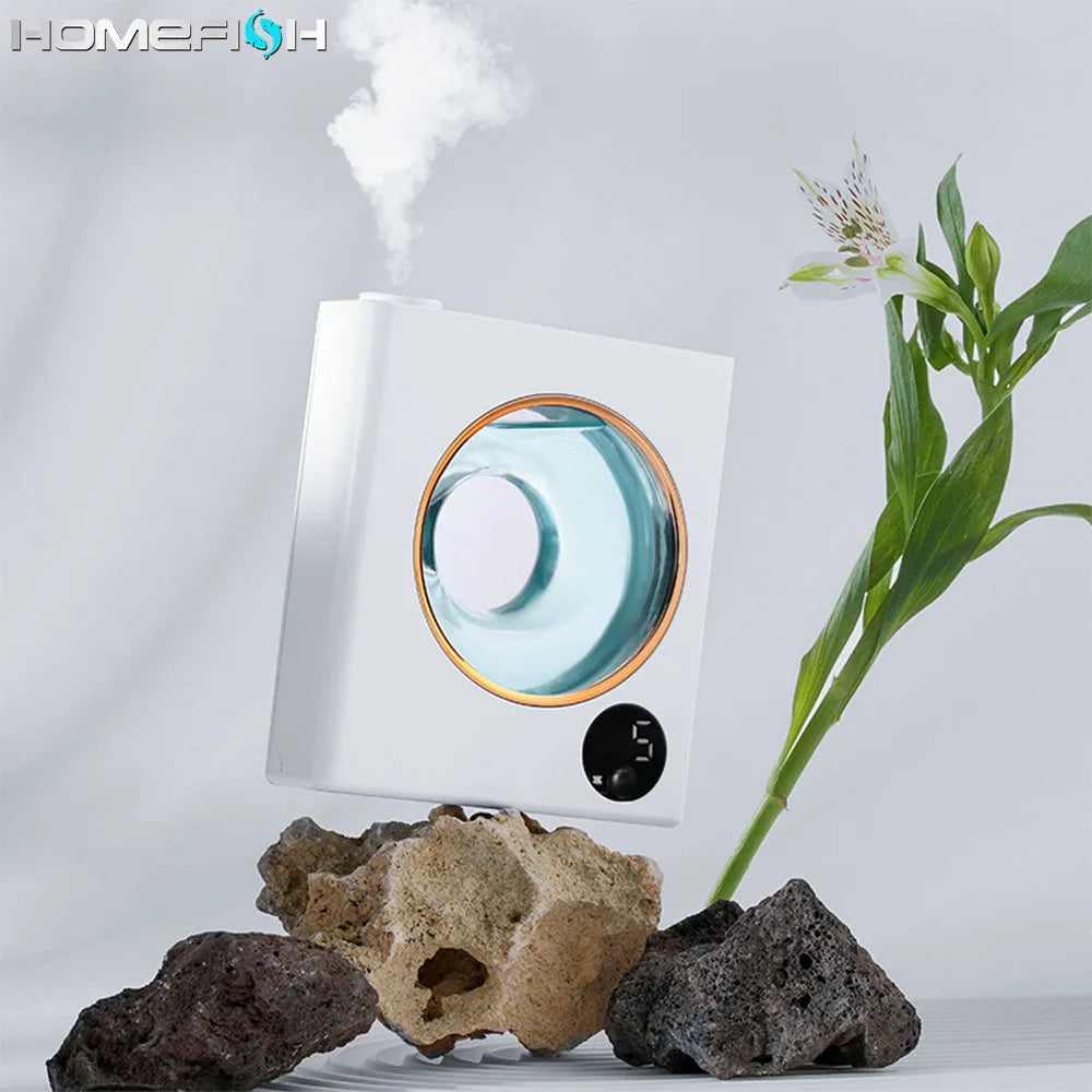 Small white automatic aromatherapy machine mounted on a wall with USB charging cable.