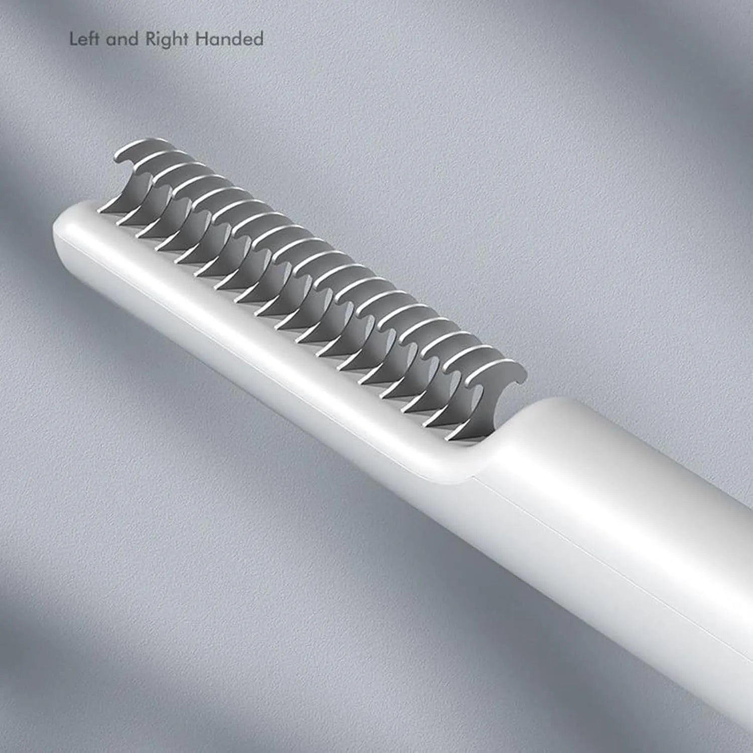 Pink and white stainless steel dog dematting comb with ergonomic handle for removing hair knots and mats.