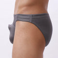 Men's loose-fit navy blue nylon underwear laid flat, showing elastic waistband and leg openings.