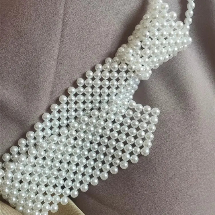 Pearl tie body chain with hollow out design and imitation pearl details in retro style