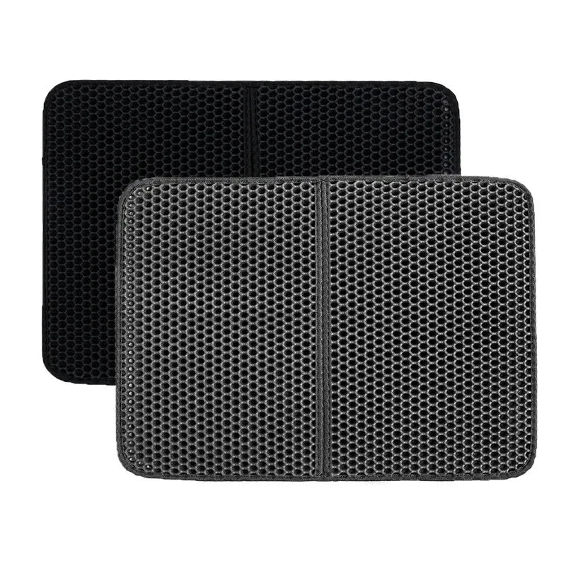 Black EVA foam cat litter pad with honeycomb design beside litter box