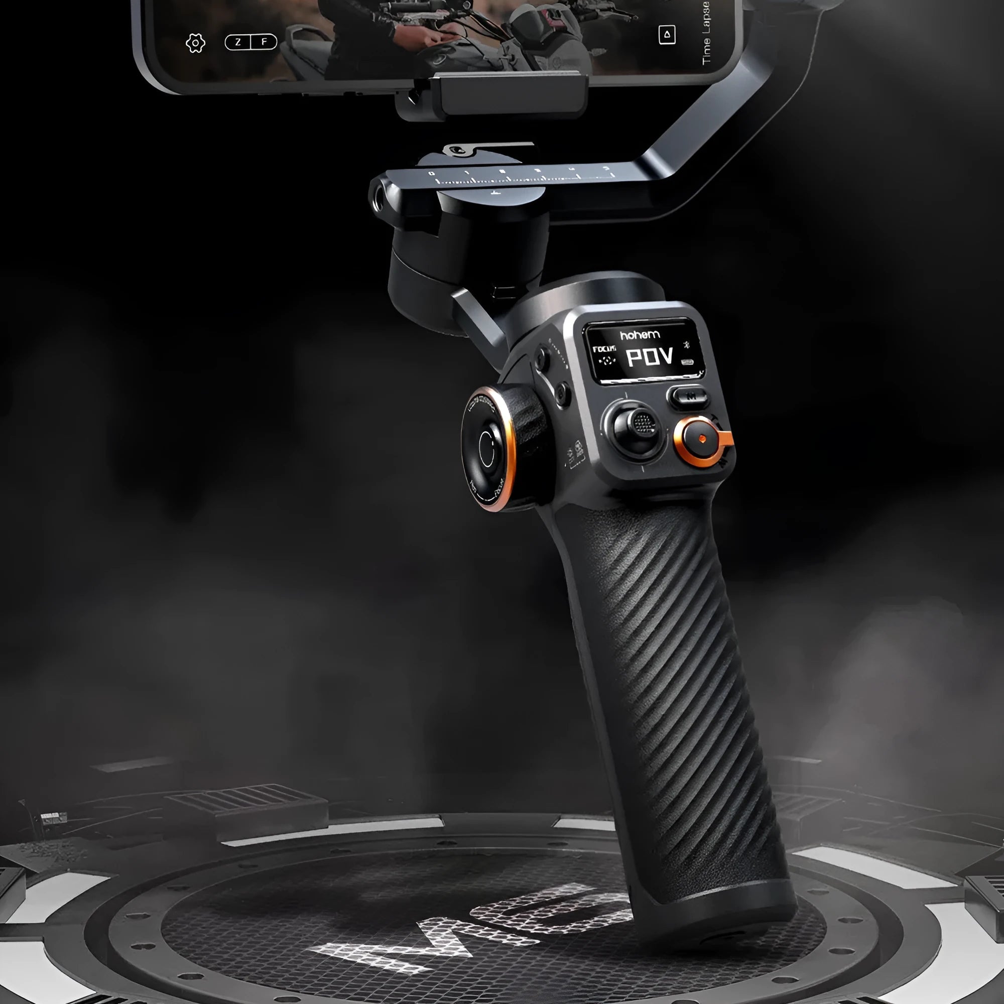 Black three-axis smartphone gimbal stabiliser with magnetic AI fill light attached and tripod extended