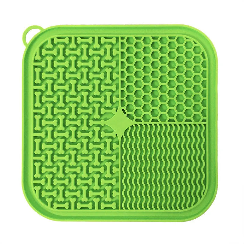 Fengrong silicone slow food bowl in sky blue on a non-slip surface with a scraper alongside