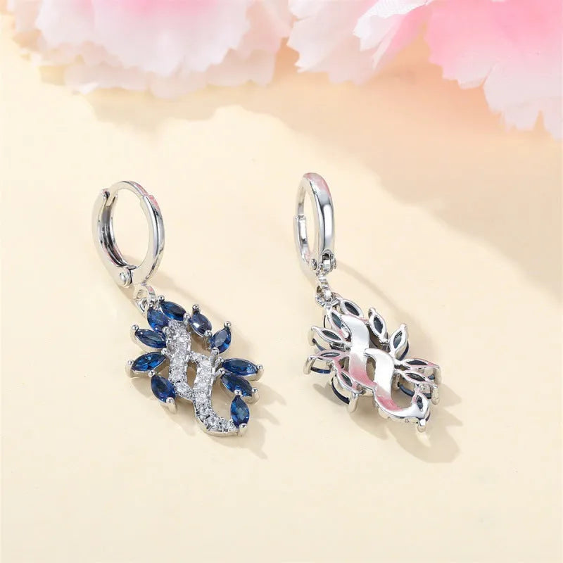 Women's simple minority style alloy earrings with platinum sapphire blue finish