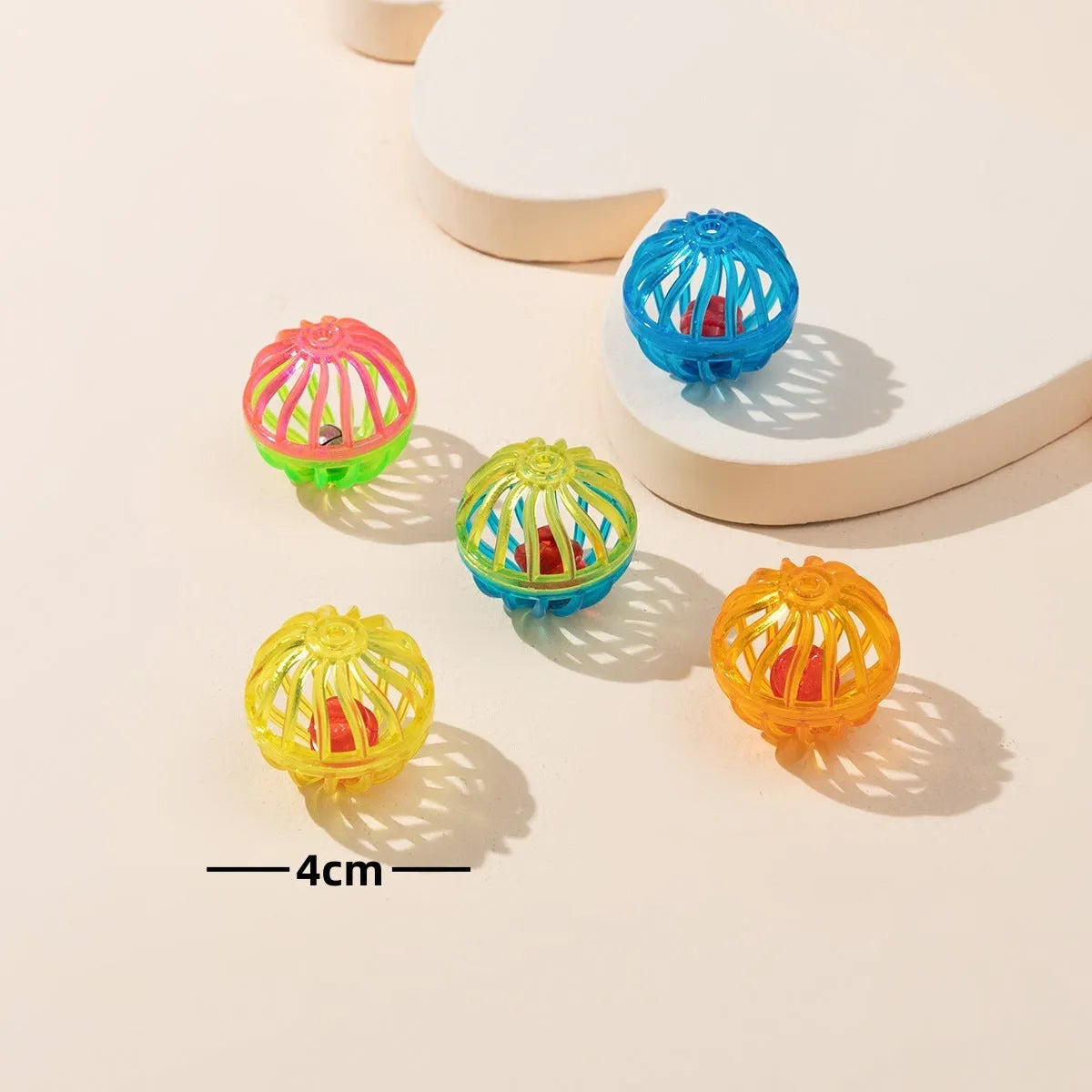 Colored plastic bell mesh hollow sound cat teasing ball in rainbow colour