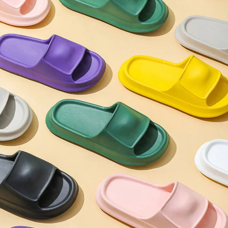 Pair of thick-soled EVA flip flop slippers in a colour option, showing non-slip tread pattern.