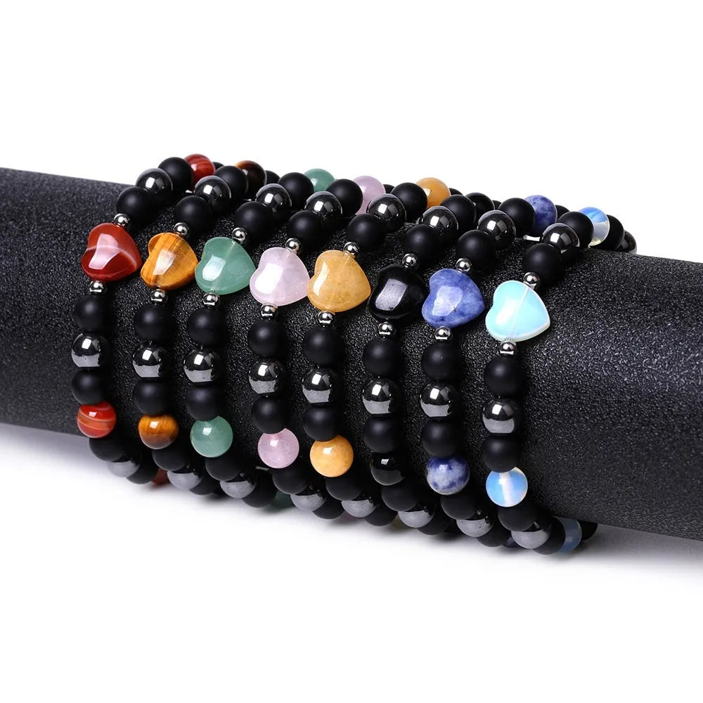 Hand-cut geometric peach heart stone bracelet with moon symbols in tigereye colour