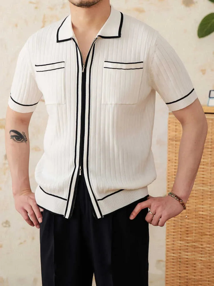 Slim fit black knitting polo shirt with short sleeves and a lapel collar laid flat.