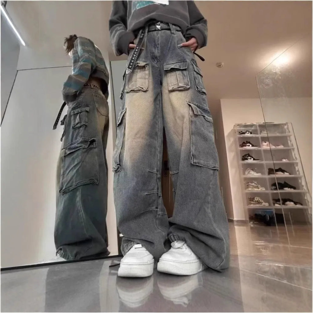 Men's light blue loose fit distressed denim jeans with multiple pockets in straight leg street style