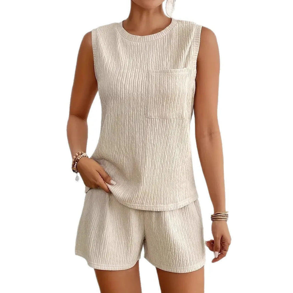Apricot polyester pyjama set with sleeveless vest and matching shorts laid flat