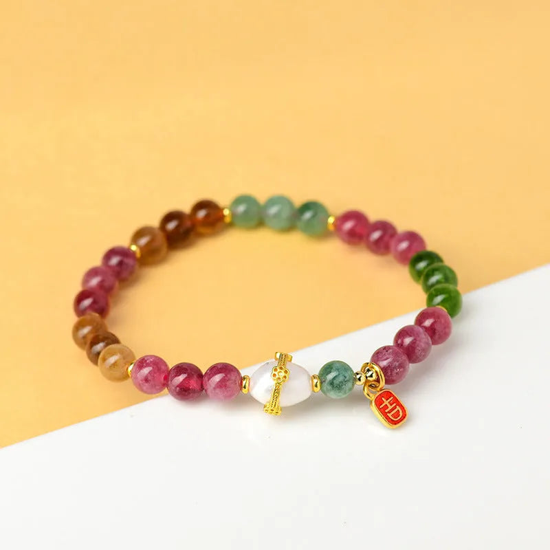Geometric chalcedony bead bracelet with adjustable string closure in tourmaline colour