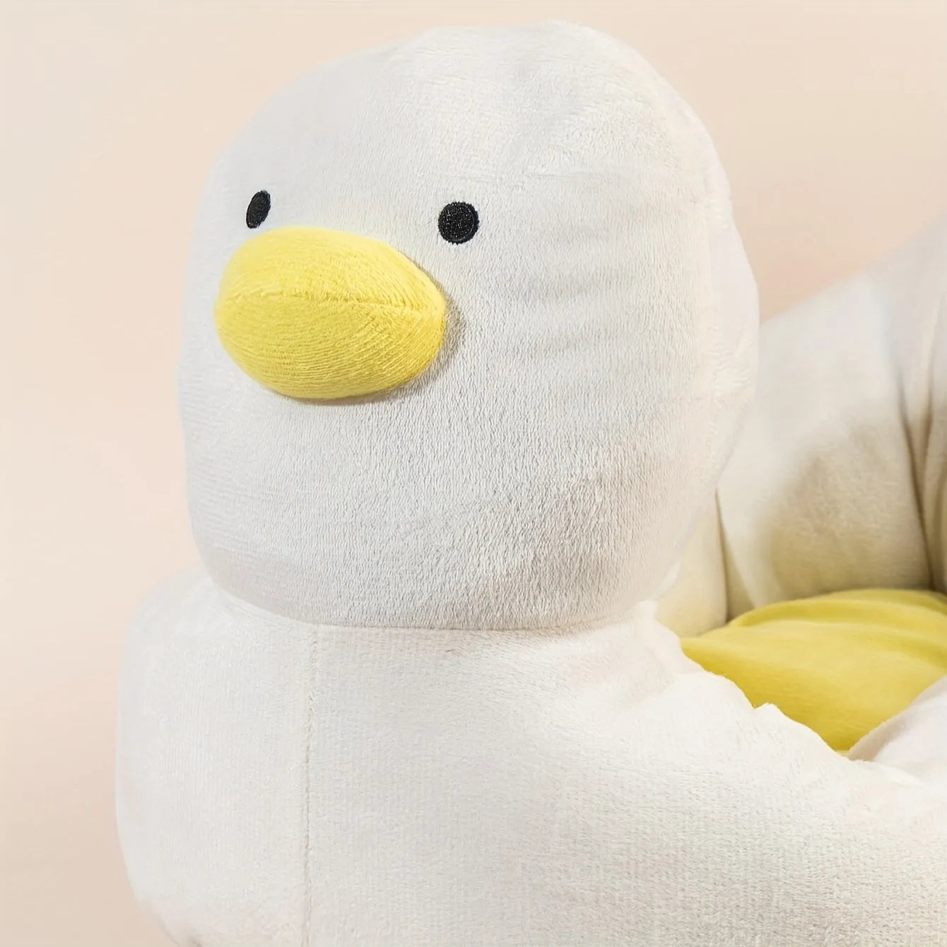 Blue duck-shaped fluffy pet bed for small dogs and cats on floor
