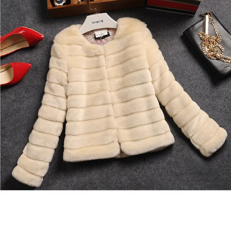 Women's cropped faux fur top in beige, black, or white with regular sleeves.