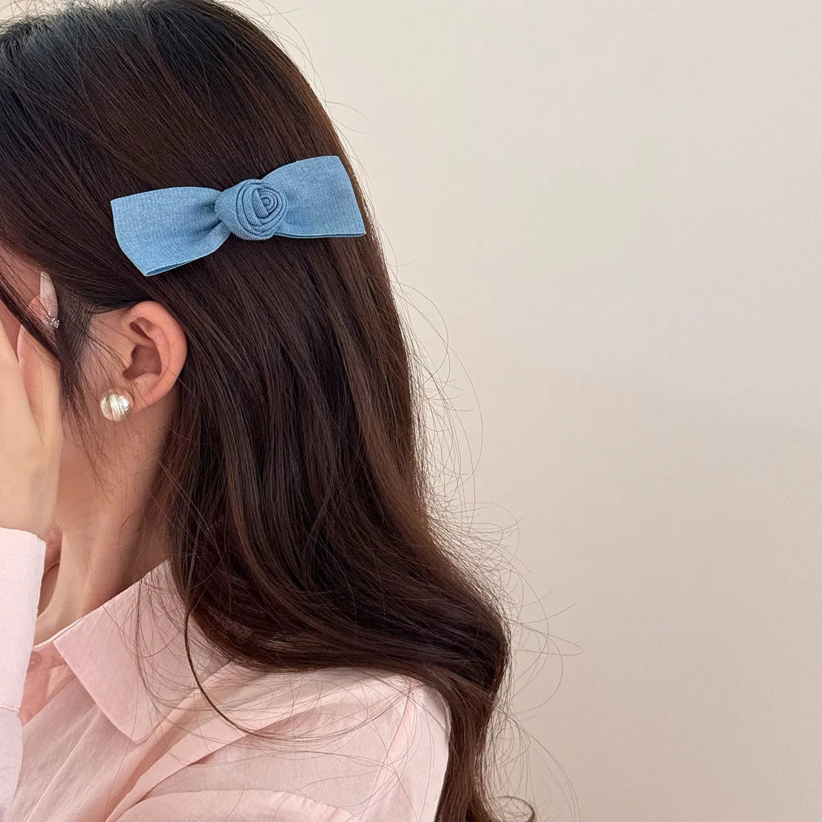 Beige lace hair rope barrette with blue bow decoration and metal clip