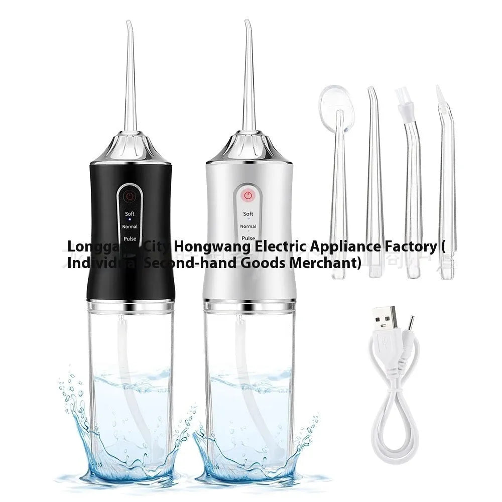 Pink portable electric water flosser with replaceable nozzles and large water tank on bathroom counter