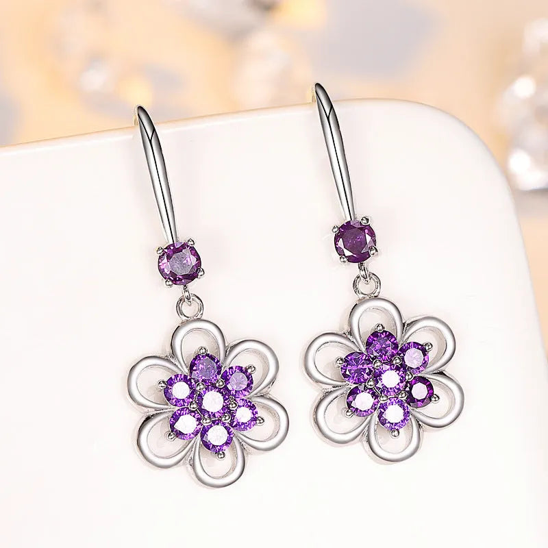 Floral white copper earrings with faceted stone accent, available as ear stud or ear hook in purple or white colour options