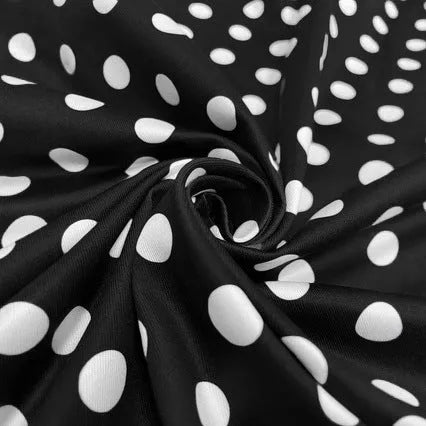 Multicolour polka dot dress with a square neckline, short sleeves, front zipper, and a pleated midi skirt on a hanger.