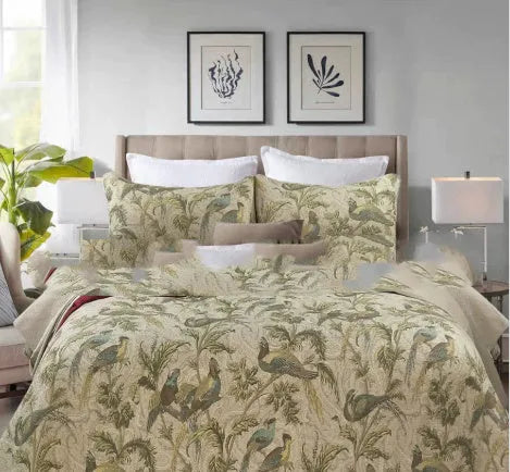 Blue American floral pattern quilted cotton bedspread set on a bed, showing pillowcases.