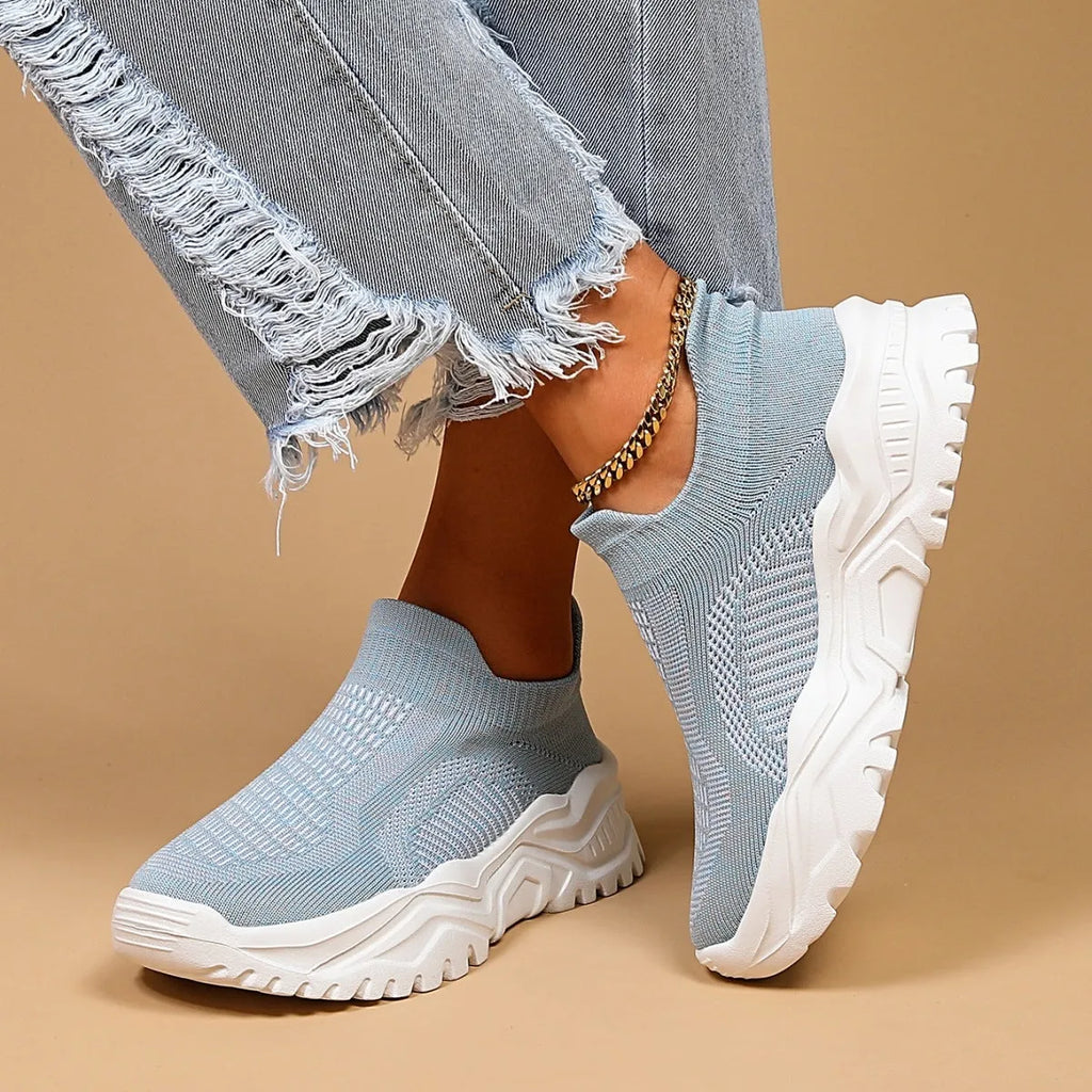 Women's light blue mesh slip-on sports shoes with round toe and mid heel