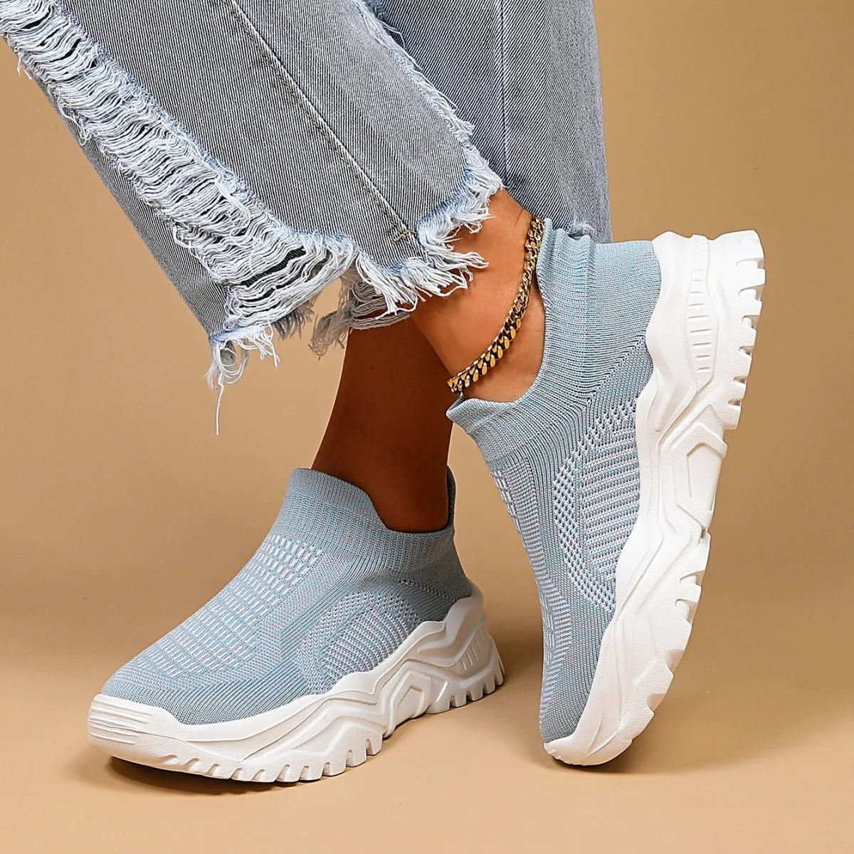 Women's light blue mesh slip-on sports shoes with round toe and mid heel