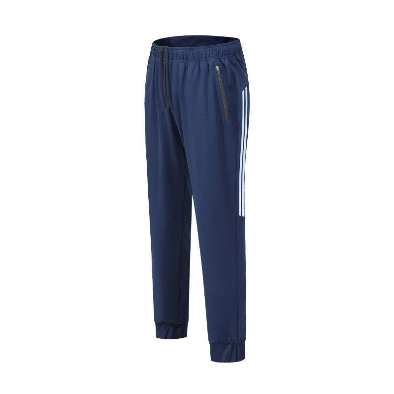 Men's black and navy blue polyester running trousers laid flat, showing full-length design.