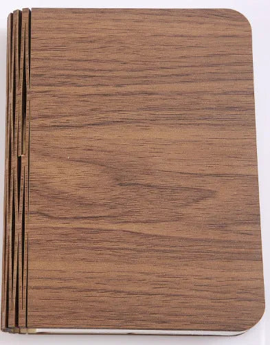 Wooden boy shaped LED night lamp in modern minimalist design with battery power