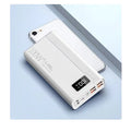 Large capacity power bank in black or white plastic casing showing front panel with charging ports