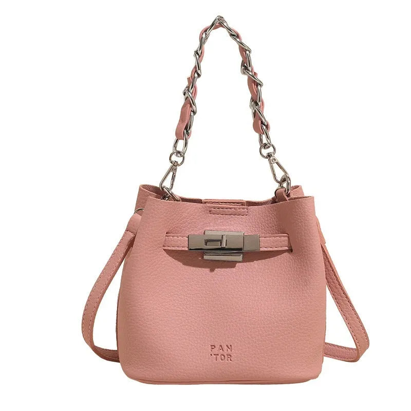 Soft PU leather retro bucket shoulder bag in black showing internal organiser pockets.