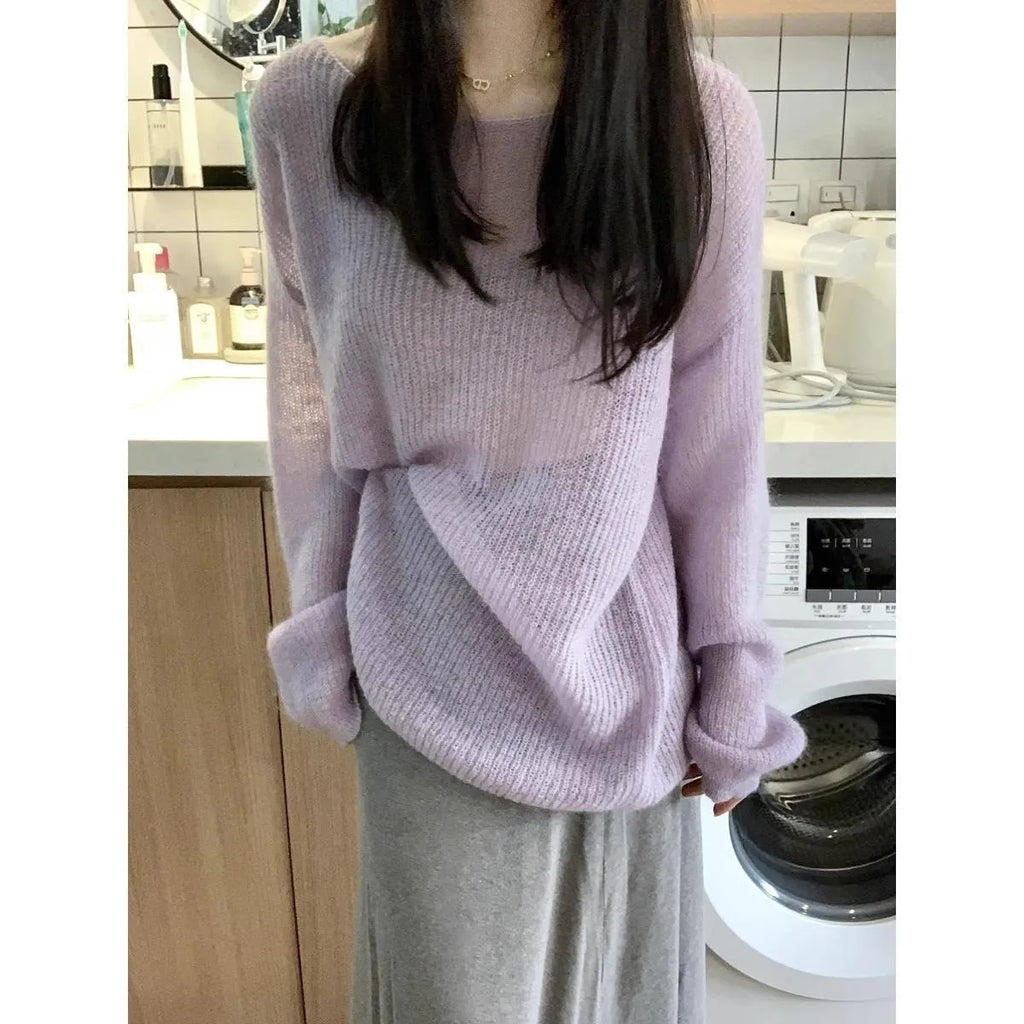 Purple women's sleeveless sweater with hollow-out design and shoulder strap detail.