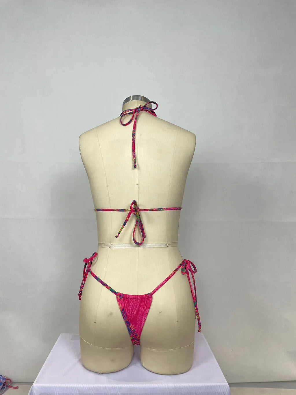 Pink printed women's bikini two-piece swimsuit set with sleeveless top and briefs