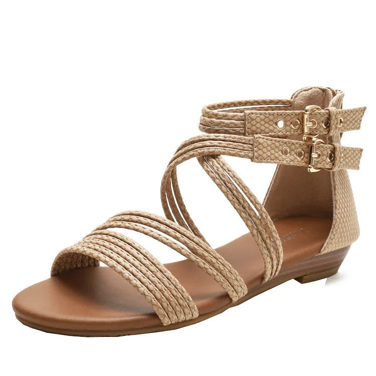 Women's open toe Roman sandals with cross strap, wedge heel, buckle, and back zipper in artificial leather.