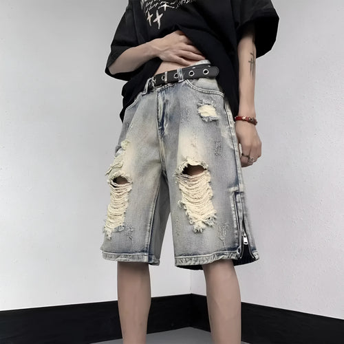 Blue retro tattered denim shorts with a wide leg loose fit on a person