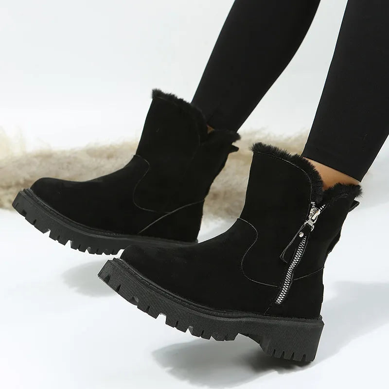 Women's black faux suede high-top snow boot with side zipper on a non-slip rubber sole.