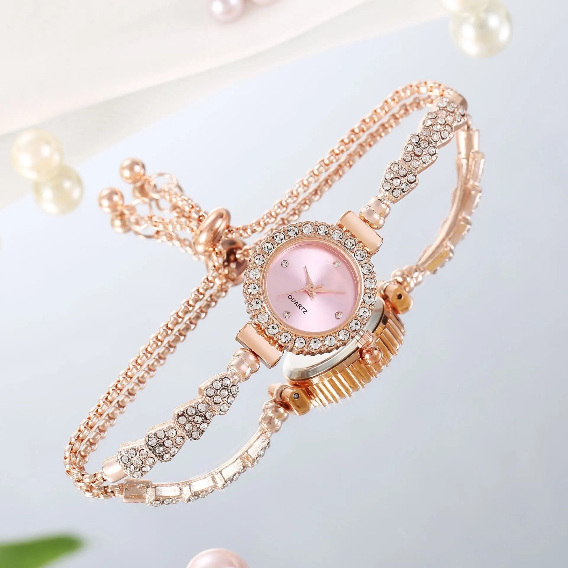 Gold fine strap women's watch with round dial and stainless steel jewellery buckle
