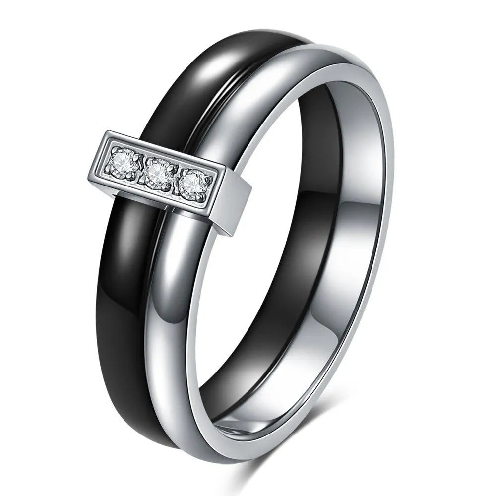Close-up of a women's geometric ceramic ring with a 6mm wide band and glossy stitching detail, shown in a gold white electroplated finish.