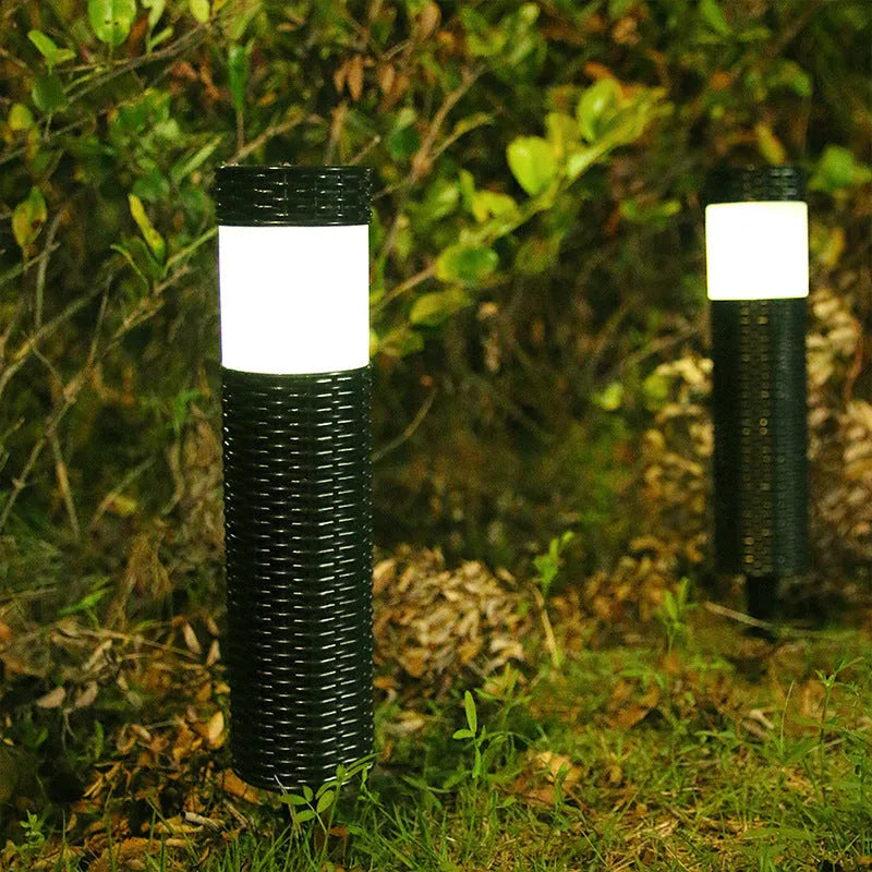 Modern abstract solar-powered outdoor garden light with waterproof casing.