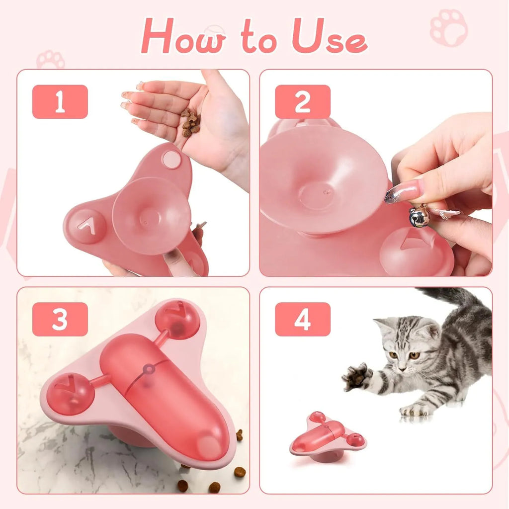 Blue interactive pet puzzle toy with airplane cabin snack dispenser, bell, and catnip on a suction cup base