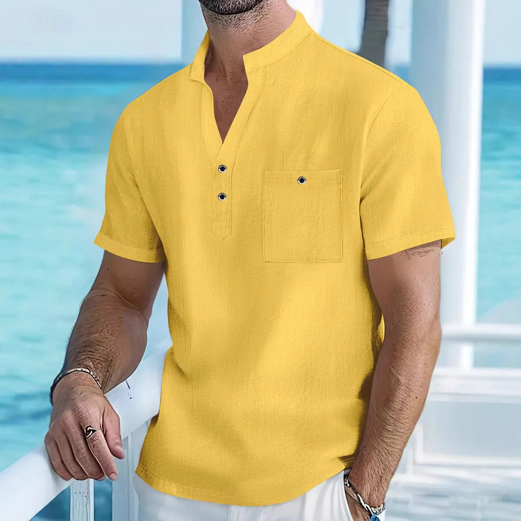 Man wearing a light apricot coloured stand collar linen blend short sleeve t-shirt with a loose fit.