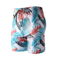 Men's cropped swimming trunks in a blue leaf pattern, made from polyester and spandex blend.