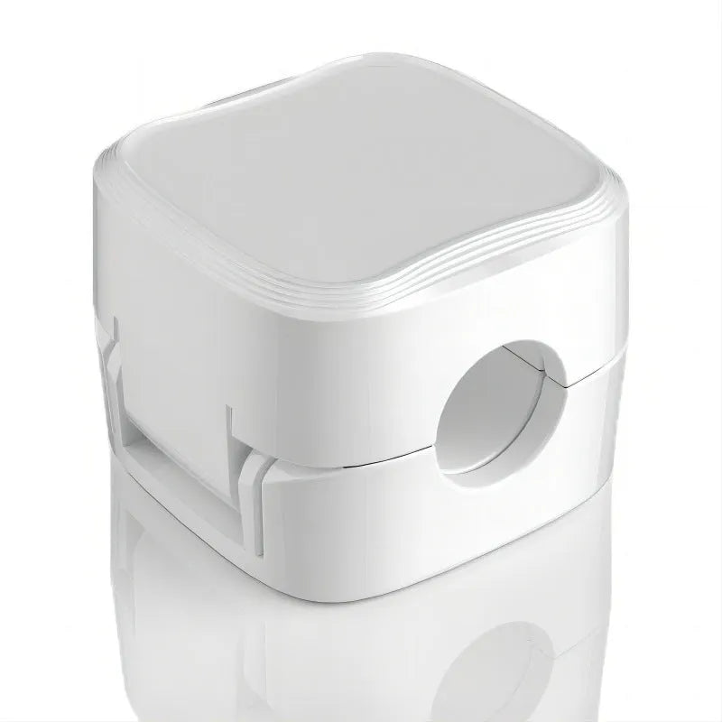 Black and white magnetic cable clips with adhesive backing for under desk cable management.