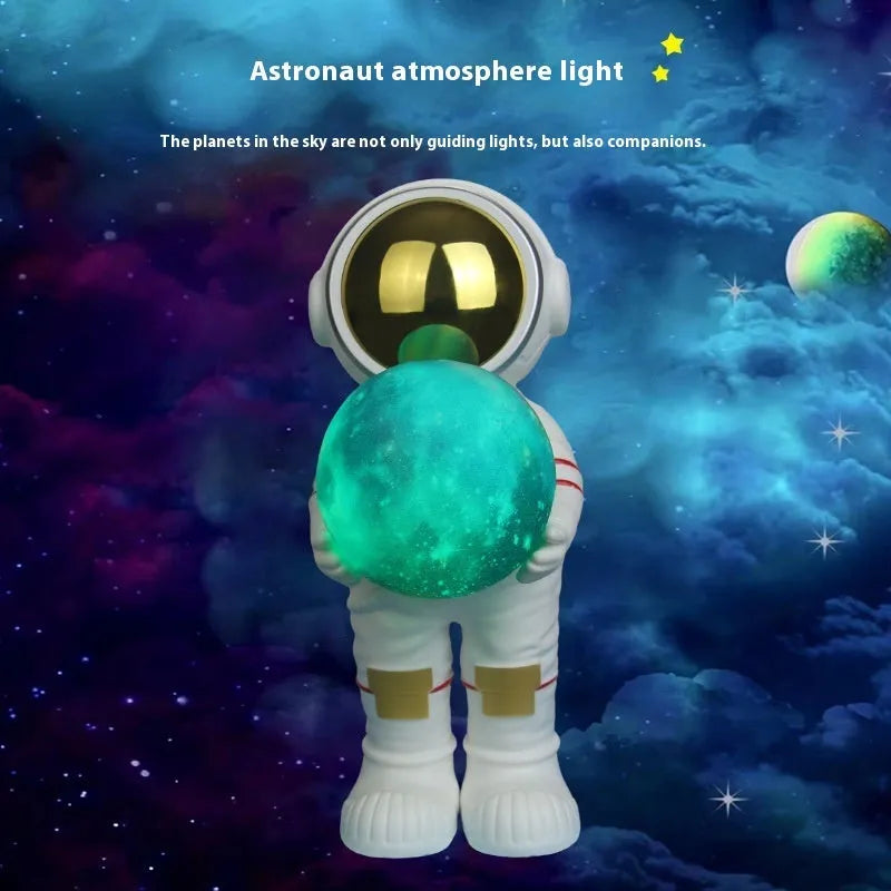 Spaceman starry sky projection lamp showing six-colour LED lighting on dark surface