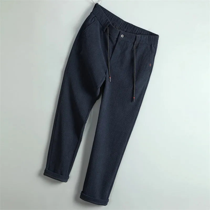 Men's striped casual trousers in black, dark blue, gray, dark khaki, or apricot, made of polyester, sizes 29-40.